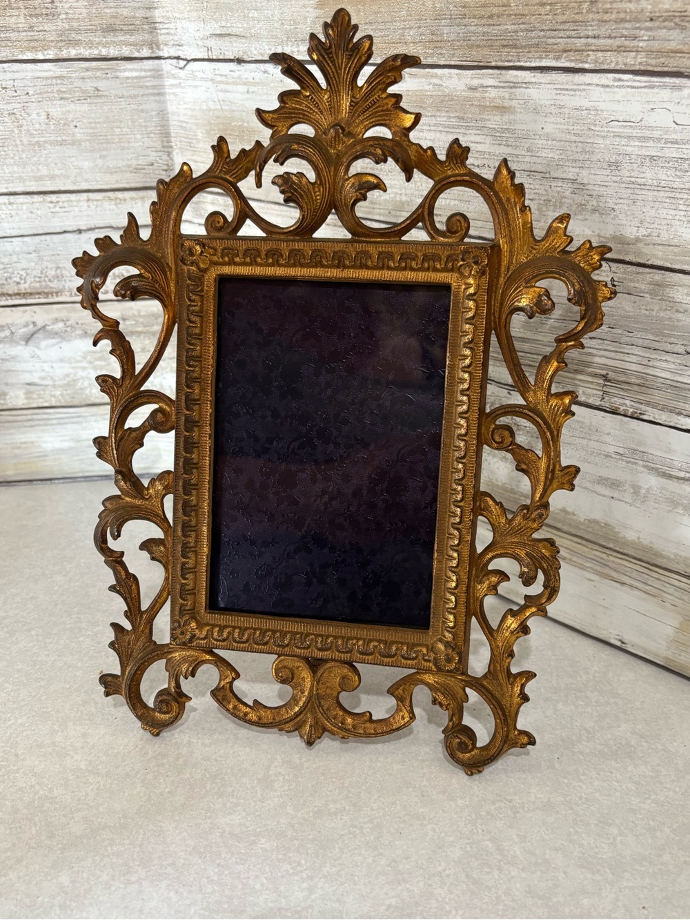 Heavy ornate brass easel-style  photo frame